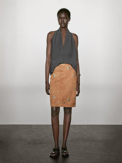 Suede leather skirt with rhinestone detail